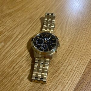 GUESS Men's Analog Quartz Watch with Gold-Tone Stainless Steel Bracelet